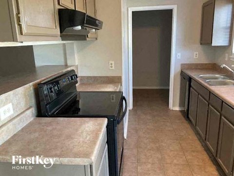 a kitchen with a stove and a sink