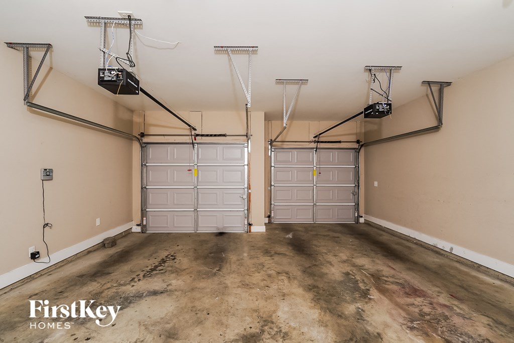 a garage with two walk in closets and a concrete floor