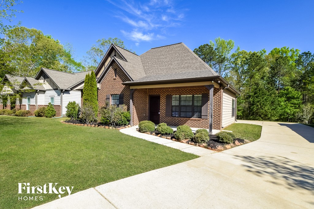 A house with a driveway in front of it.