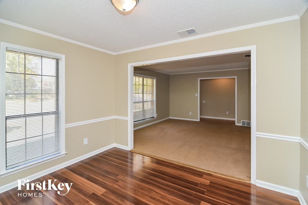 A room with wooden floors and a white ceiling.