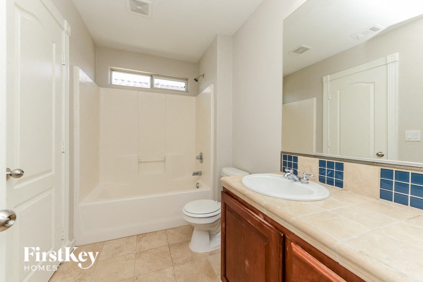 a bathroom with a sink toilet and a shower