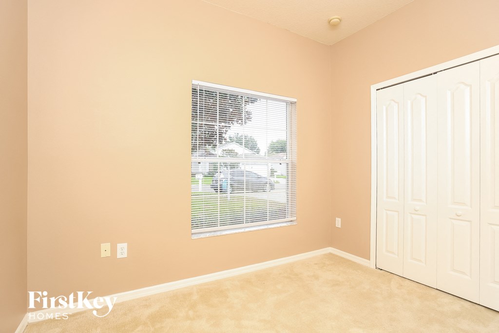 A room with a window and a door is shown.