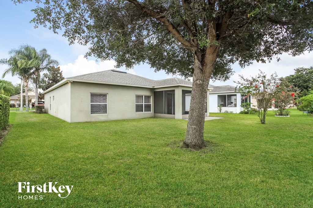 A house with a tree in front of it.