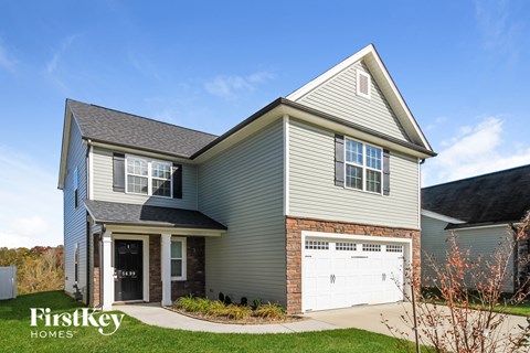A house with a garage door that says FirstKey Homes.