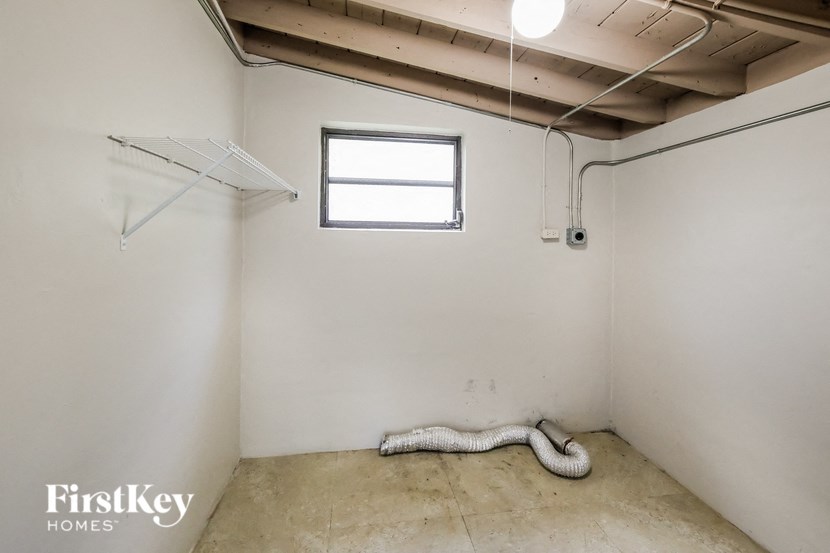 a white room with a white snake in the floor