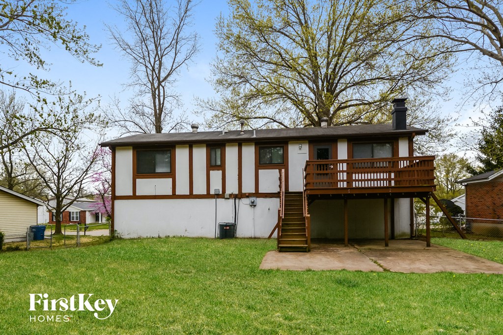 A house with a brown and white exterior is for sale.