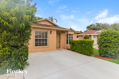 a home with a driveway and a garage door