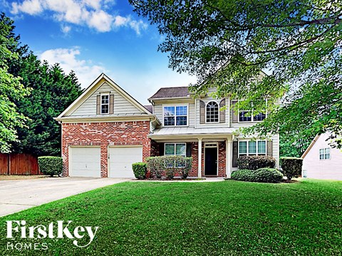 a suburban house with a lawn and a garage