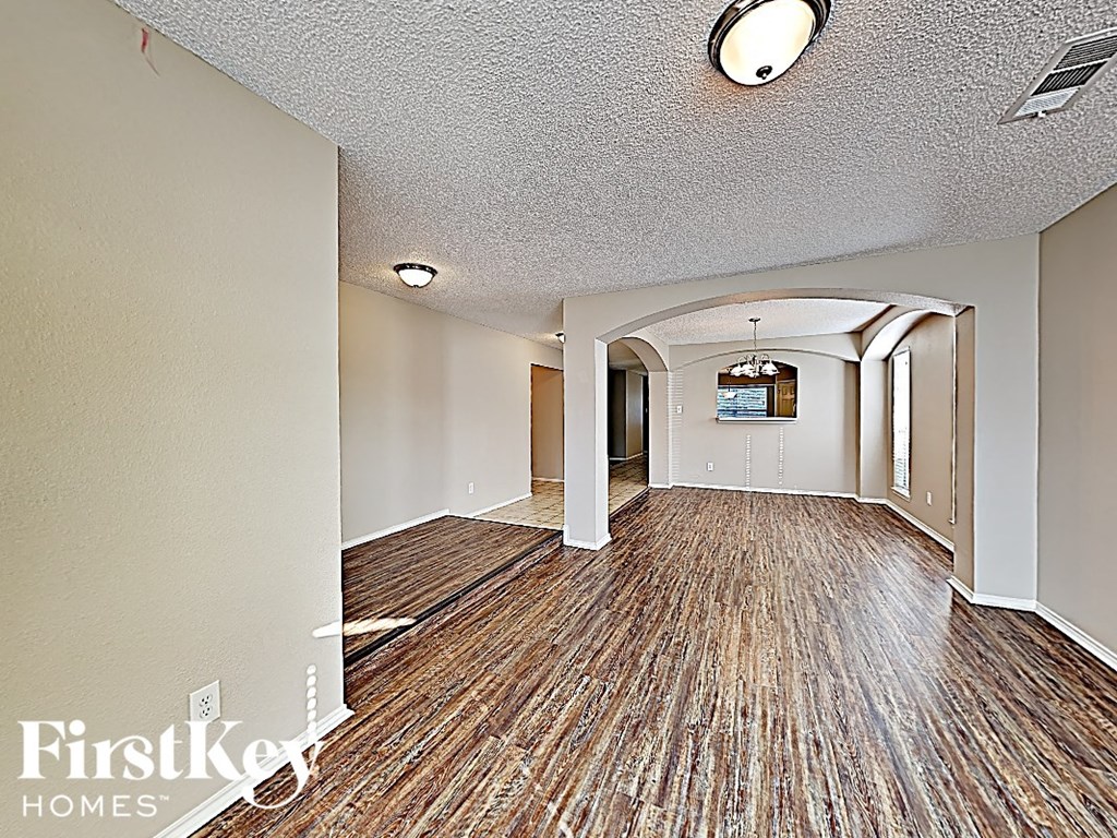 the living room and dining room are open to the kitchen and living room