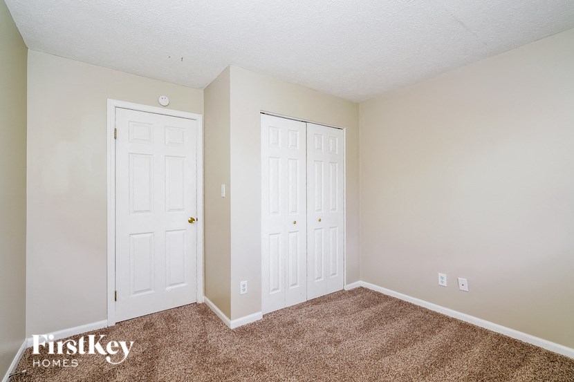 the living room of a home with two white doors