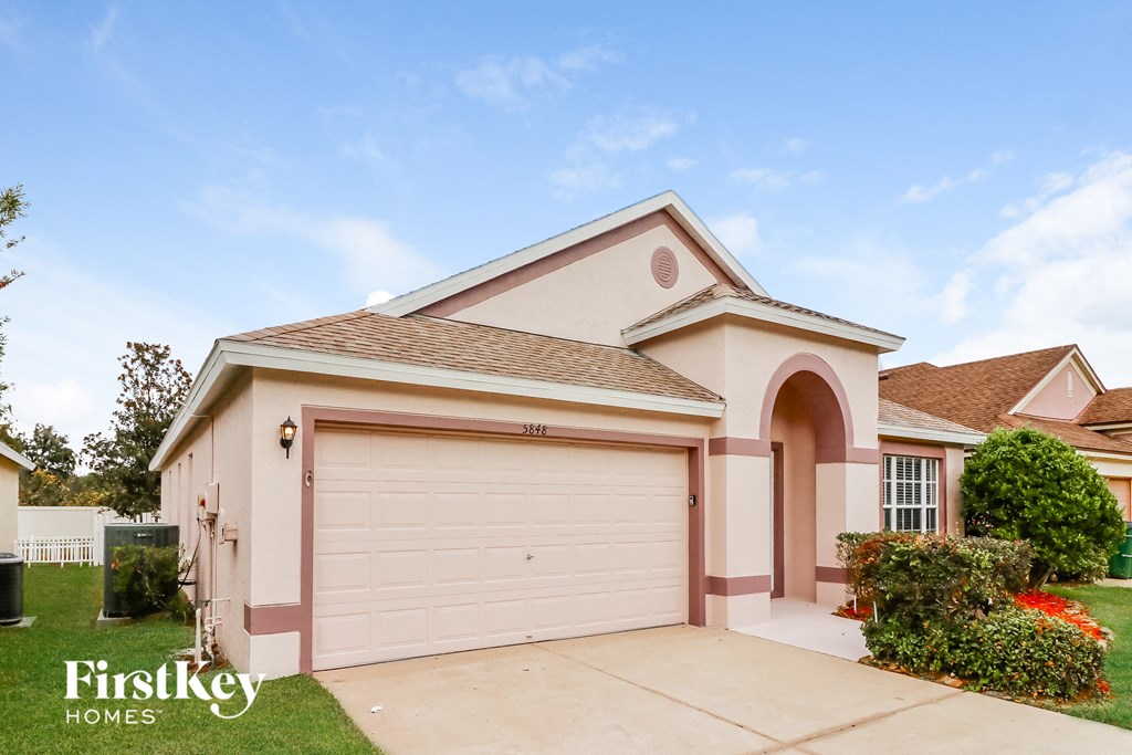 A two-car garage is attached to a house.