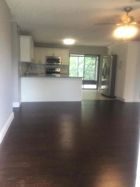A kitchen with a stove top oven and a microwave.