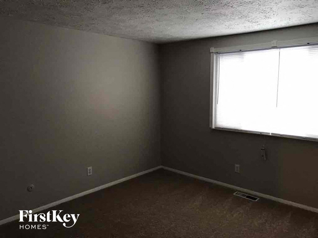 an empty room in a house with a window