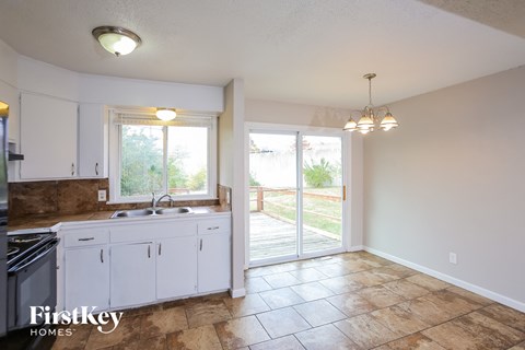A kitchen with a sink and a window.