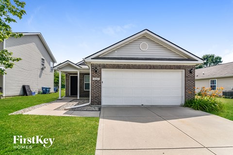a white garage door in front of a house