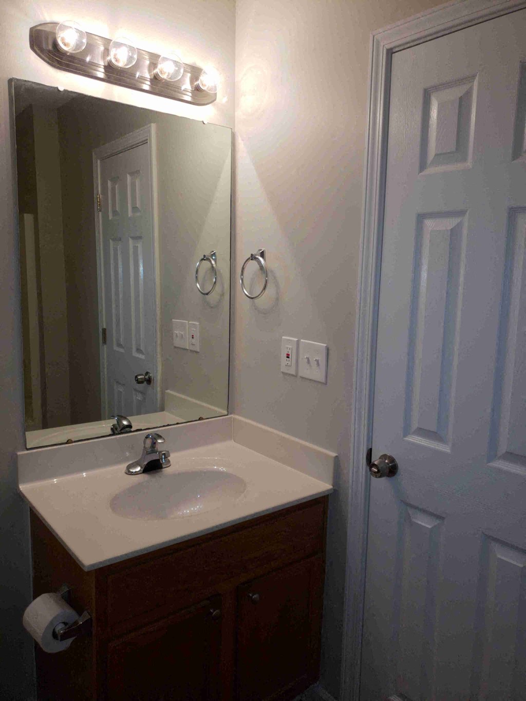 a small bathroom with a sink and a mirror