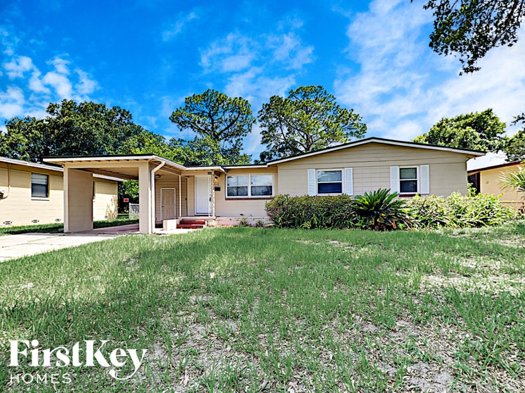 a small house with a yard in front of it