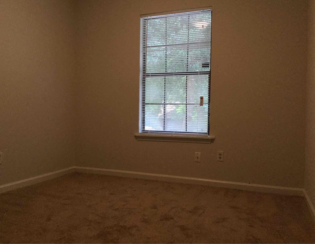 an empty room with a window in it