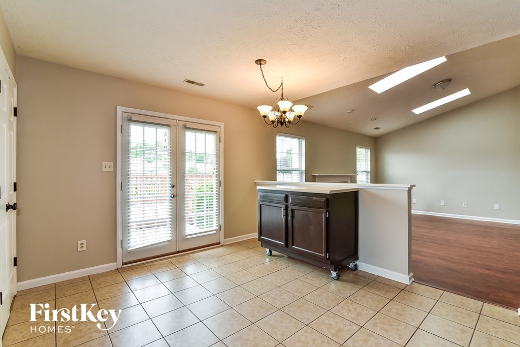 the kitchen is open to the dining room and living room