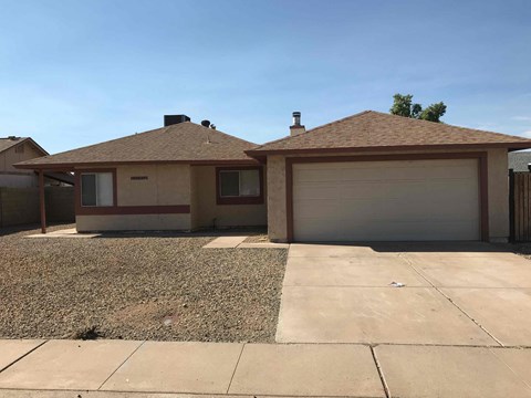 a house with a driveway and a garage door