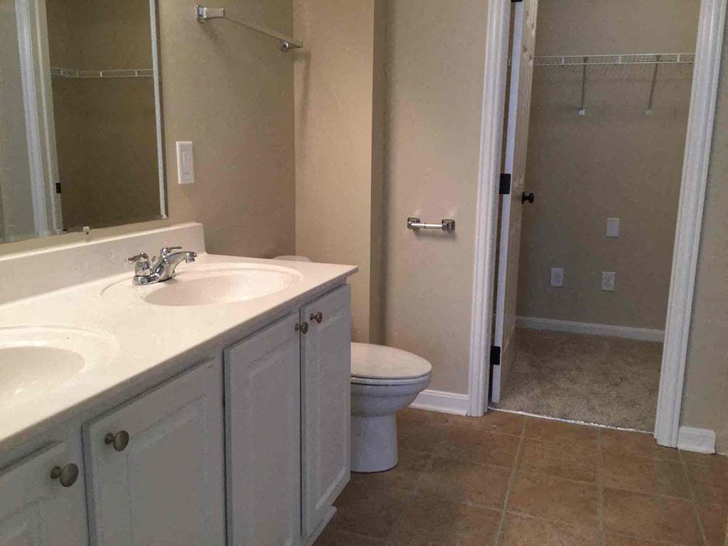 a bathroom with a sink toilet and a shower