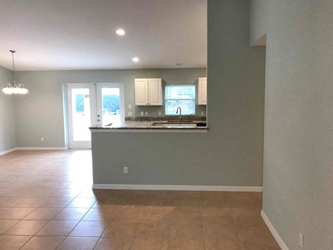 A kitchen with a counter and cabinets is shown.