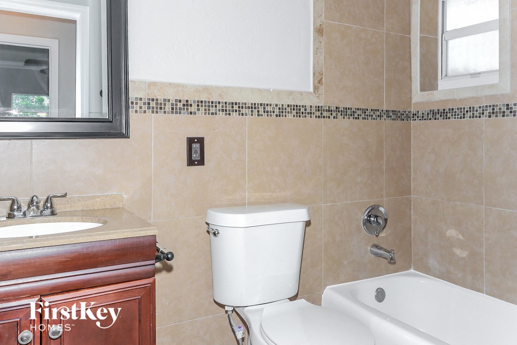 a bathroom with a toilet and a sink