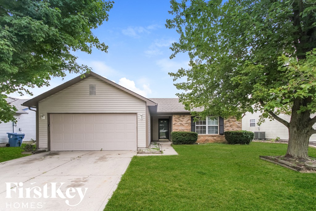 A house with a garage is for sale by FirstKey Homes.