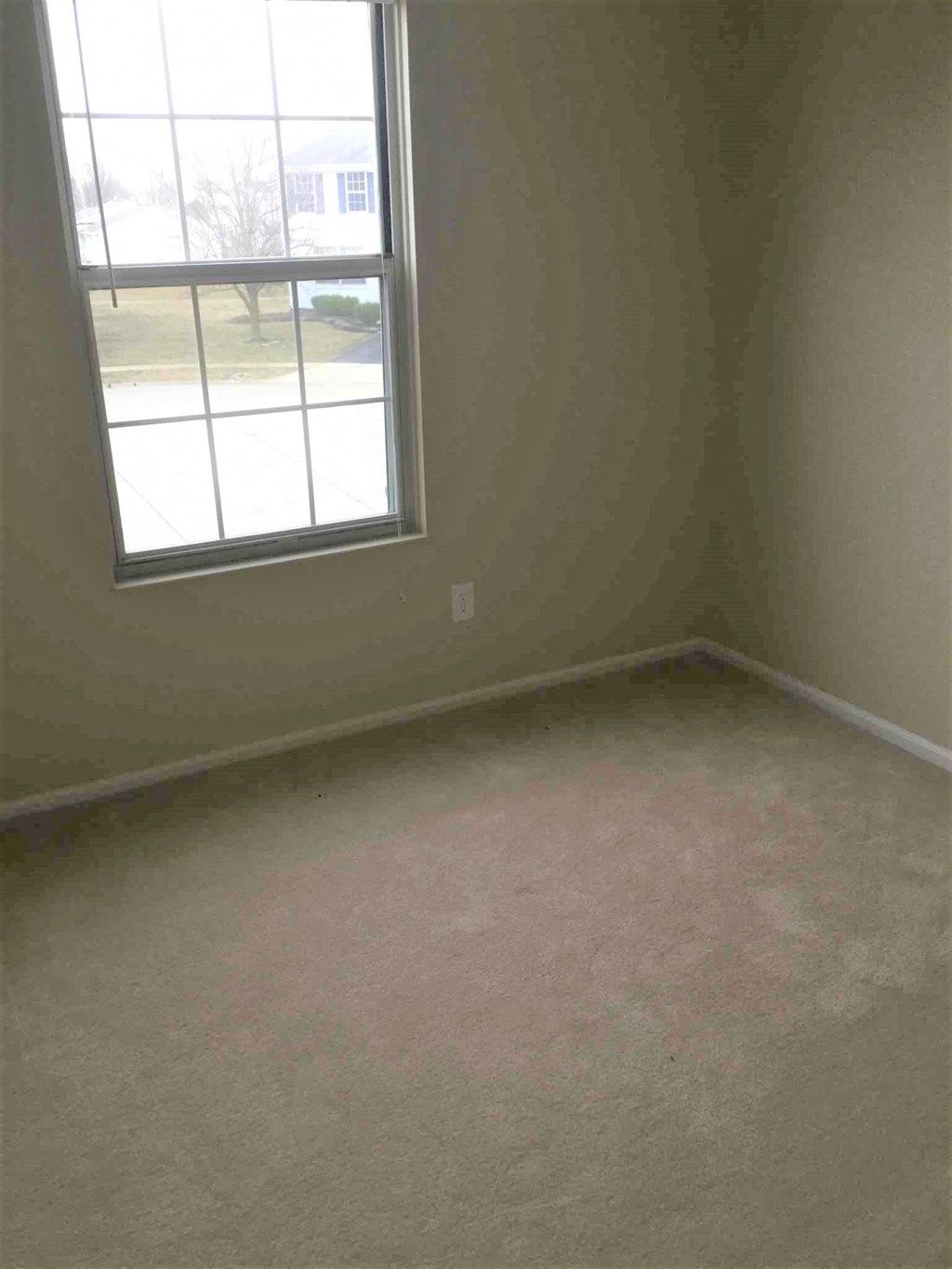 an empty room with a window in it