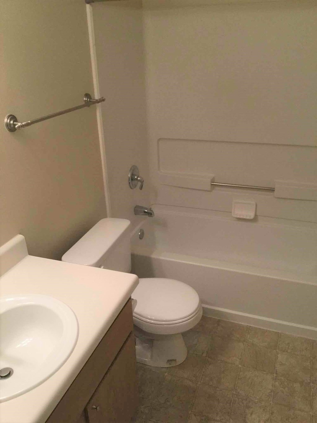 a bathroom with a sink toilet and a bath tub