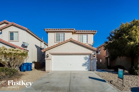 a home with a white garage door in front of it