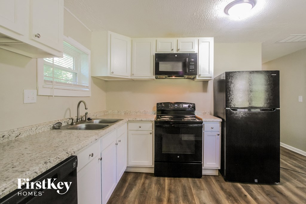 the preserve at ballantyne commons apartment kitchen with black appliances