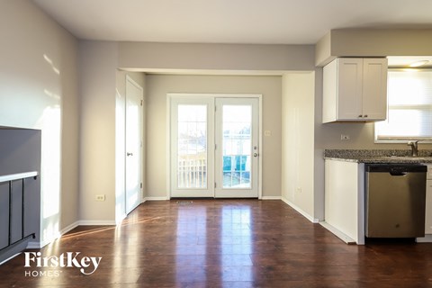 A kitchen area with a sink and a window.