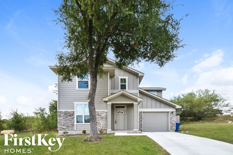 a house with a tree in front of it