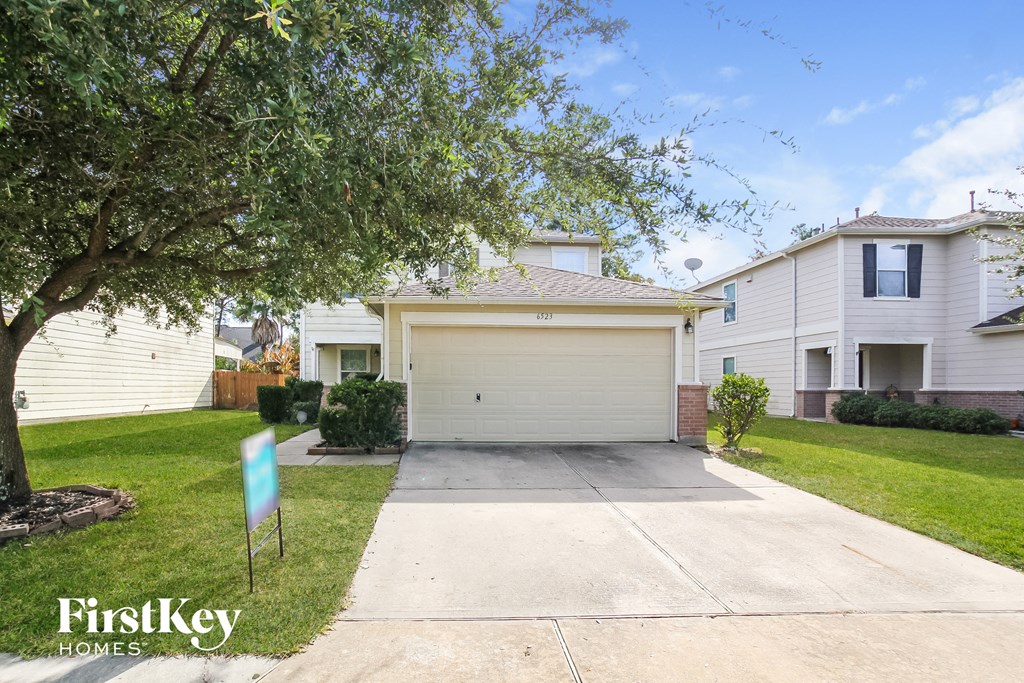 A house with a garage is for sale by FirstKey Homes.