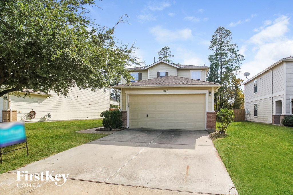 A house with a garage is for sale by FirstKey Homes.
