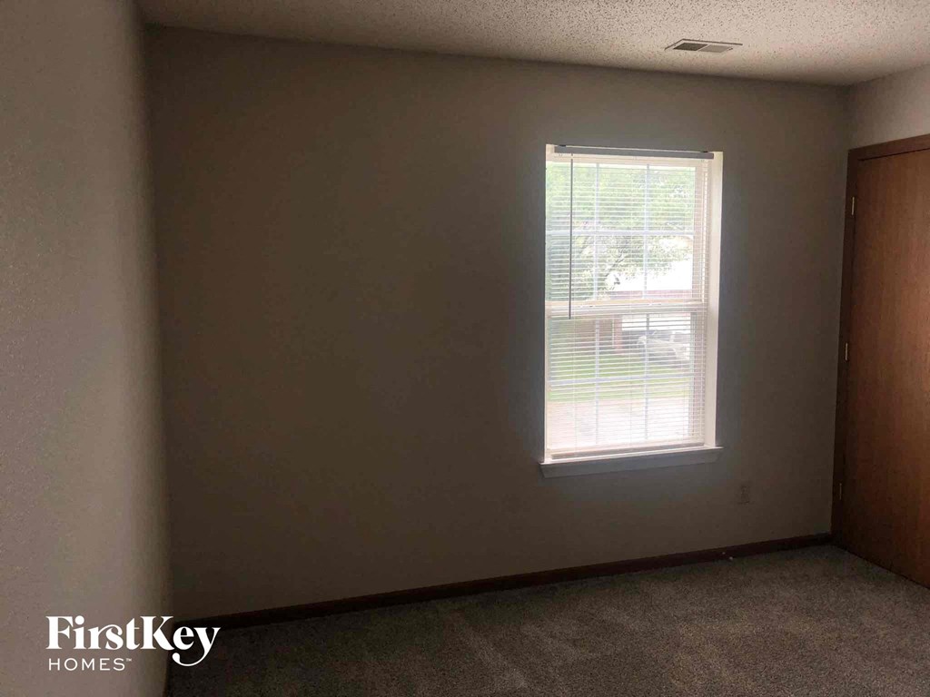 an empty room with a window in it