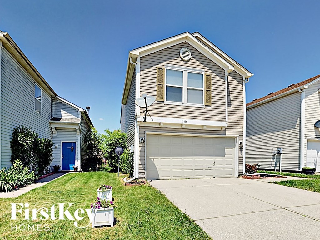 A house with a garage is for sale by FirstKey Homes.