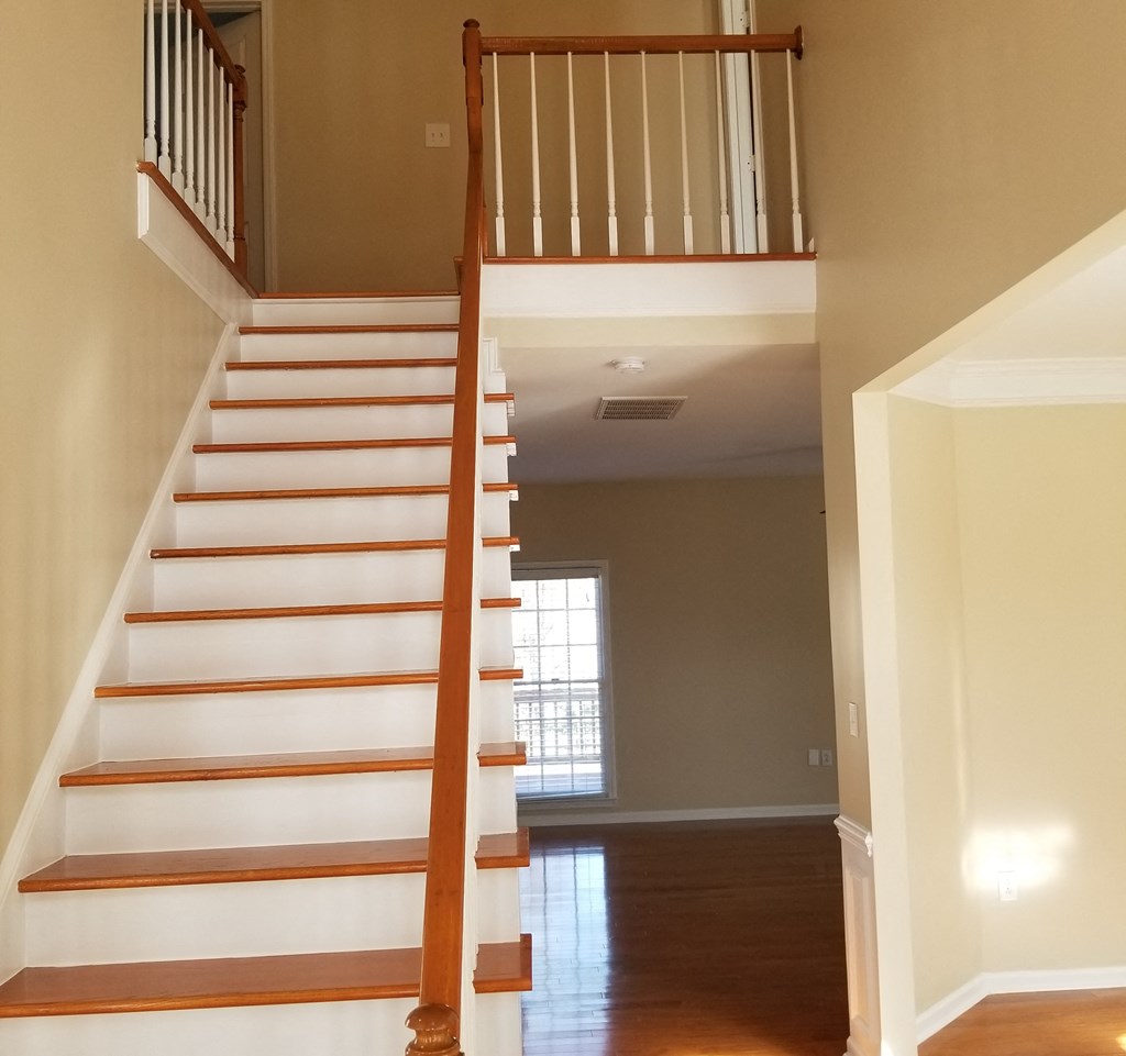 the view of a staircase in a home from the bottom of it
