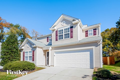 a white house with a white garage door