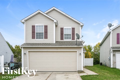 a white house with a white garage door