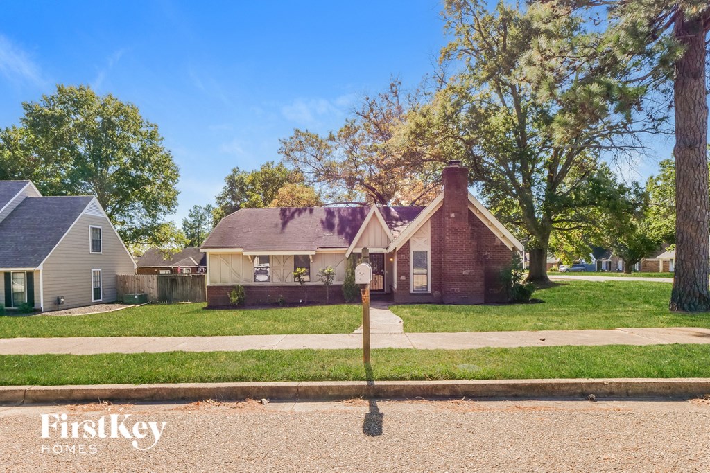A house with a sign that says FirstKey Homes in front of it.