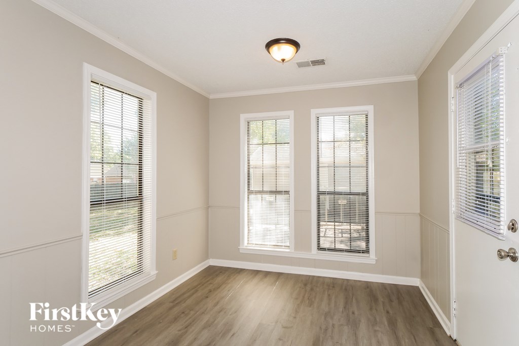 A room with a FirstKey Homes logo on the bottom left corner.