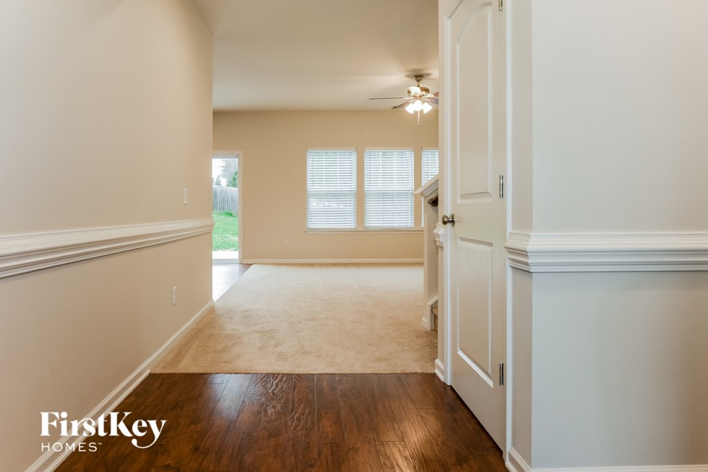 a view of the kitchen and living room from the dining room