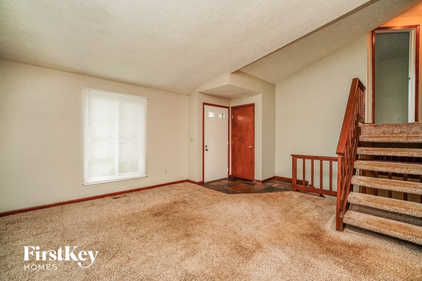 a fisheye view of the living room from the stairs