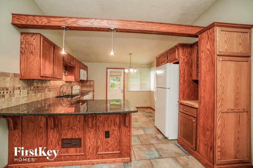 a kitchen with wooden cabinets and a counter top