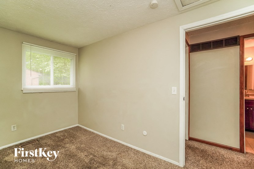 the master bedroom has a closet and a door to the bathroom