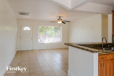 A kitchen with a counter and a window.