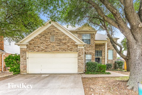 a brick house with a white garage door