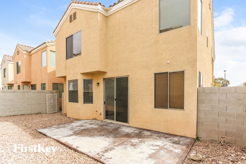 a large brick house with a driveway in front of it
